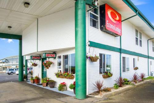 a building with potted plants on the side of it at Econo Lodge Newport in Newport