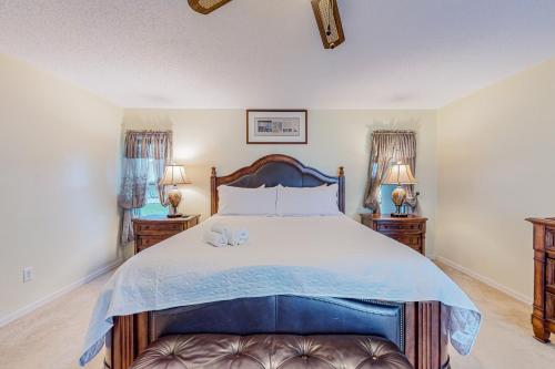 a bedroom with a large bed with two night stands at Palm Bay Getaway in Palm Bay