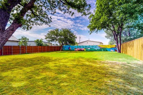a large yard with a fence and a playground at McKinney Marvel in McKinney