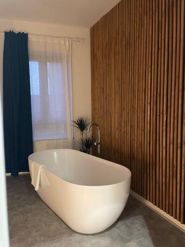 a large white bath tub in a bathroom at Dimora 7 fontane in Paola