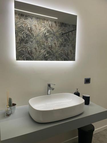 a white sink on a counter in a bathroom at Dimora 7 fontane in Paola