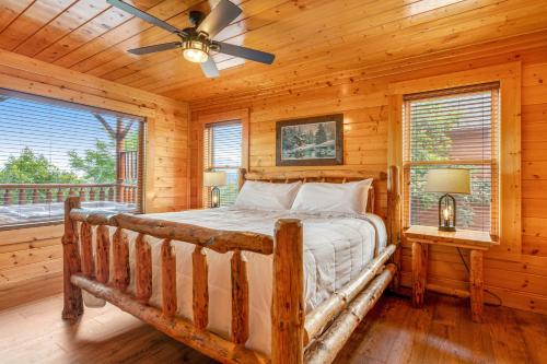 a bedroom with a bed in a log cabin at The Sweet Escape in Sevierville