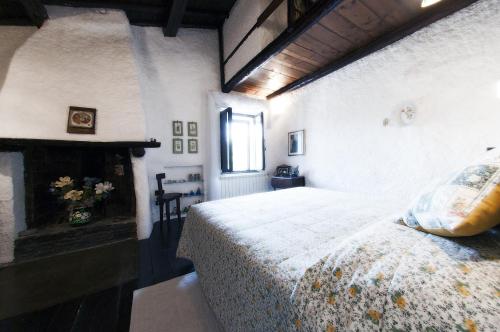 Cama ou camas em um quarto em Casa Graziella al Borgo