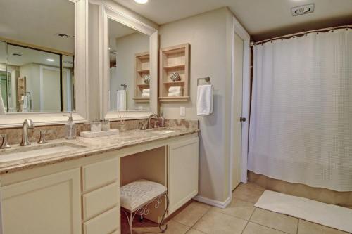 a bathroom with two sinks and a shower at Aransas Princess 112 in Port Aransas