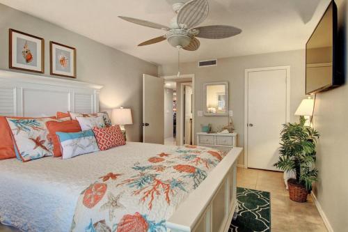 a bedroom with a bed and a ceiling fan at Aransas Princess 112 in Port Aransas