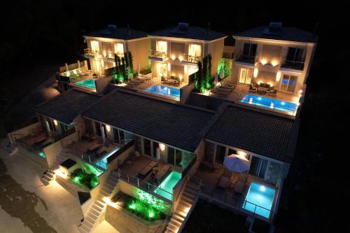 an aerial view of a house at night with lights at Elais Luxury Villas in Parga