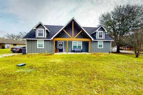 a house with a green lawn in front of it at Lake Fork Fort in Emory
