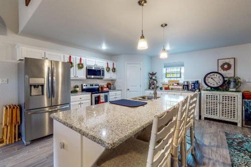 a kitchen with a large island with a counter top at Lake Fork Fort in Emory