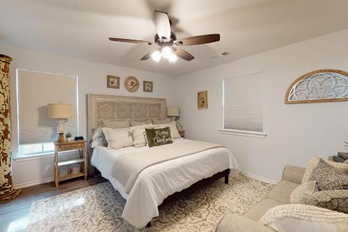 a bedroom with a bed and a ceiling fan at Lake Fork Fort in Emory