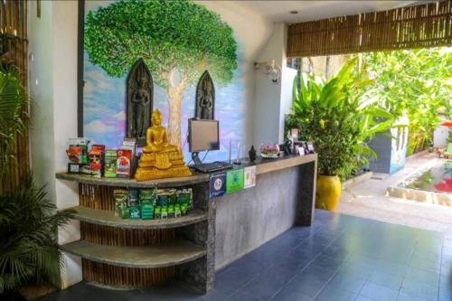 a kiosk in a room with a painting on the wall at Green BOUTiQUE in Siem Reap