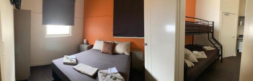 a bedroom with a bed and a bunk bed at Inspirations Mullewa in Mullewa
