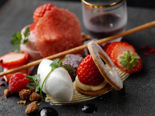 a plate of food with strawberries and ice cream at Lake Shikotsu Tsuruga Resort Spa Mizu no Uta in Chitose