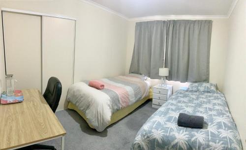 Postel nebo postele na pokoji v ubytování Radiata Homestay