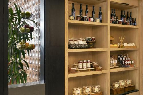 a display cabinet with bottles of wine in it at Napa Valley Marriott Hotel & Spa in Napa