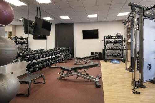 a gym with rows of exercise bikes and weights at Napa Valley Marriott Hotel & Spa in Napa