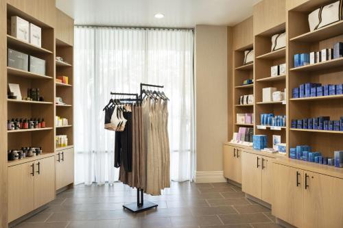 a room with shelves and a rack of clothes at Napa Valley Marriott Hotel & Spa in Napa