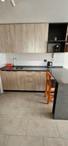 a kitchen with a sink and a counter top at Departamento Centro de Valdivia, Caupolican in Valdivia