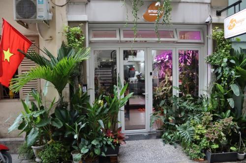 a store front with plants in front of it at Amango Dorm in Ho Chi Minh City