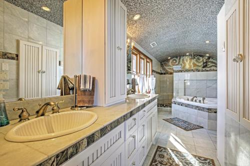 a bathroom with two sinks and a tub at Mountaineer Manor in Glenwood Springs