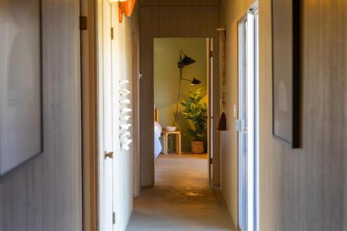 a hallway with a hallway leading to a room at Designer Hideaway in Borrego Springs