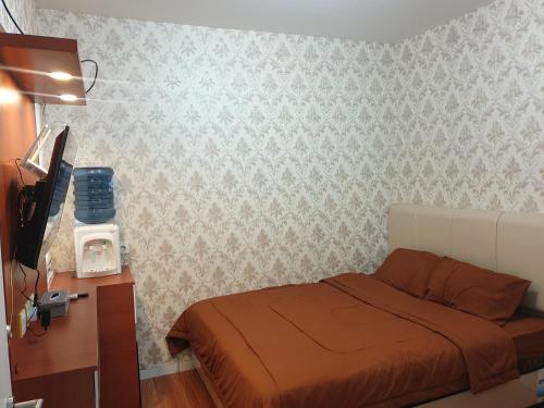 Postel nebo postele na pokoji v ubytování Bolang Apartel