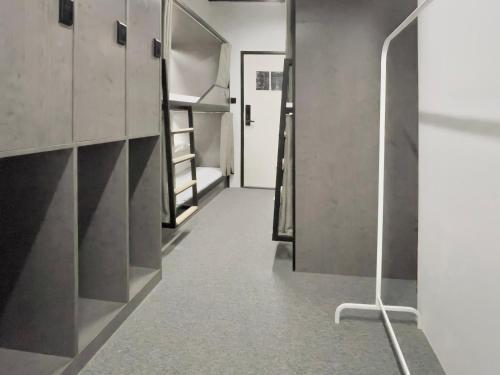 a hallway of a room with bunk beds at Sifang Space Hostel Xi'an - Xi'an TIYUCHANG metro station Line2 in Xi'an