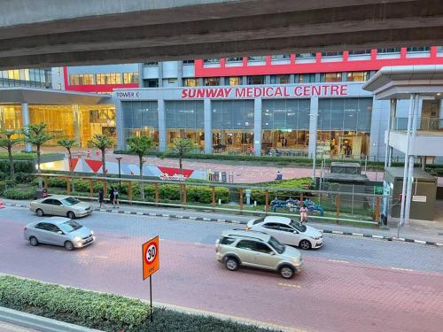 a group of cars parked in front of a medical center at Sunway Geo Suite-Linked BRT-Medical in Petaling Jaya