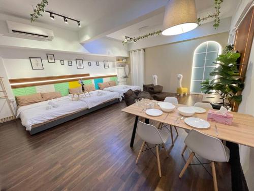 a living room with a table and a couch at Sunway Geo Suite-Linked BRT-Medical in Petaling Jaya