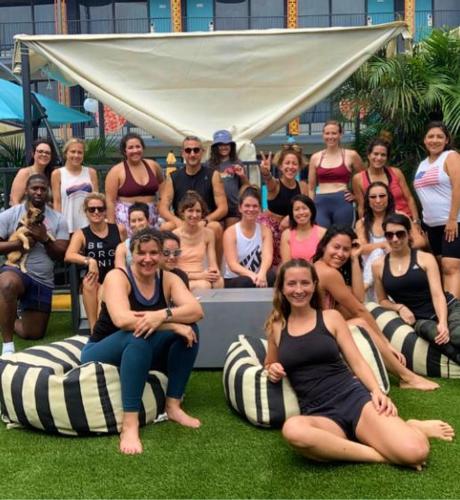 a group of people sitting on beanbags on the grass at Bposhtels Houston in Houston