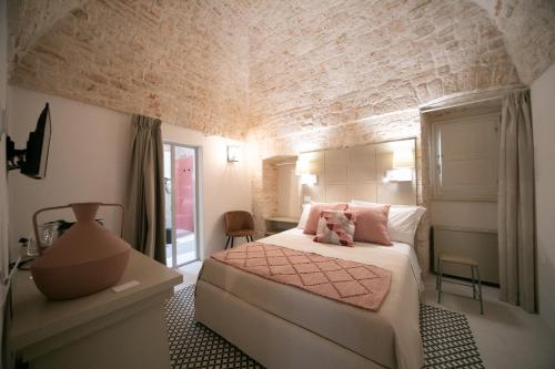 Katil atau katil-katil dalam bilik di San Marco Boutique Rooms