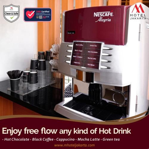 an echo coffee machine with a red and white mixer at M Hotel in Jakarta