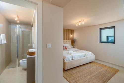 a bedroom with a bed and a shower and a toilet at Villa Slatina near Zrce beach in Novalja