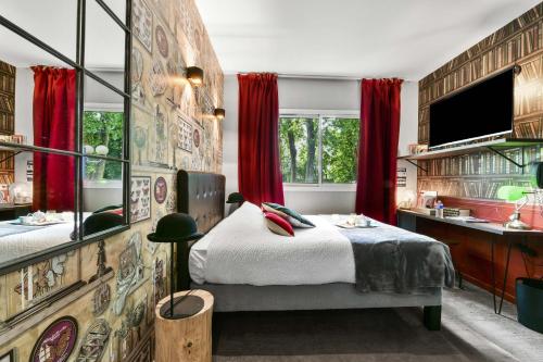 Ένα ή περισσότερα κρεβάτια σε δωμάτιο στο Logis Hôtel & Restaurant Ludik