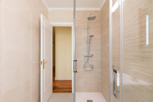 a shower with a glass door in a bathroom at Artibai - baskeyrentals in Ondárroa