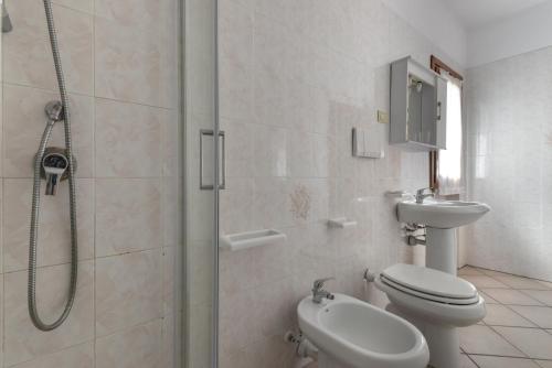 a bathroom with a shower and a toilet and a sink at Casa Castagnola in Marciana