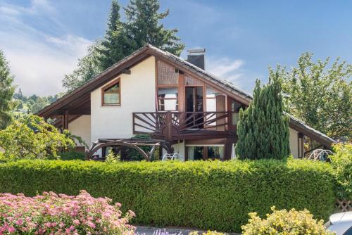 a house with a tree at Rose Garden in Heiligenberg