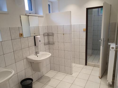 a bathroom with a sink and a toilet and a shower at Ski park Gruň in Staré Hamry