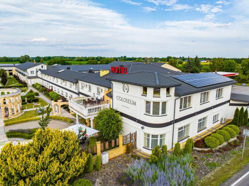 an aerial view of a hotel with solar panels on its roof at Hotel Coloseum in Jarosław