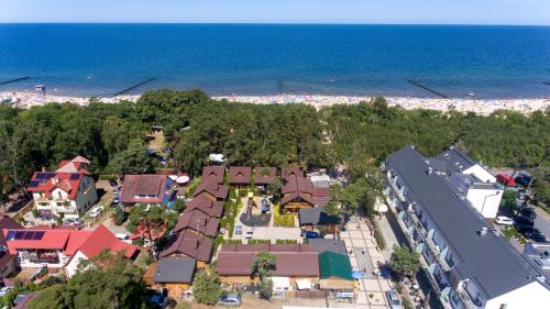 an aerial view of a town next to the beach at Domy z Bala - Bungalow 50 metrów od Plaży spa domki ogrzewane in Dziwnówek