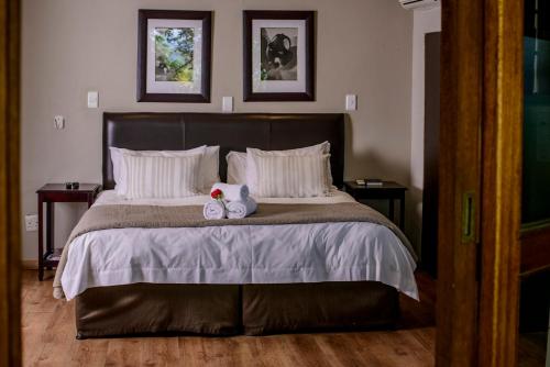 Ένα ή περισσότερα κρεβάτια σε δωμάτιο στο Zebrina Guest House
