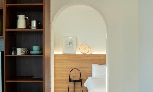 a room with a bed and a book shelf at Paul Mare Pool Villa in Busan