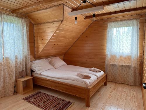 Posteľ alebo postele v izbe v ubytovaní Cabanówka