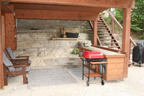 a stairway with a desk and a chair and a staircase at Natura Sauna in Laulasmaa