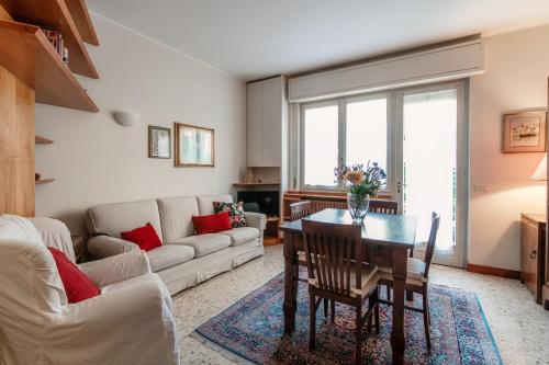a living room with a table and a couch at Mulino Nuovo by Quokka 360 - spacious apartment on the Swiss border in Como