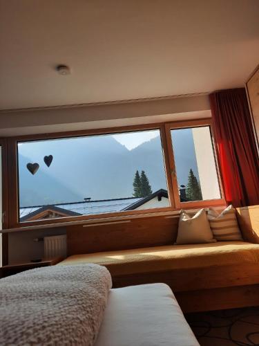 Cama o camas de una habitación en Valbella Appartements