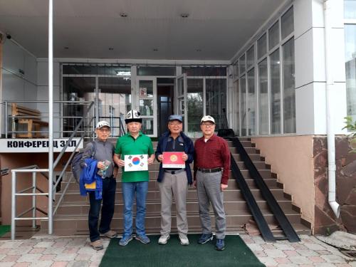 a group of people standing in front of a building at Tagaytay Karakol Hotel in Karakol