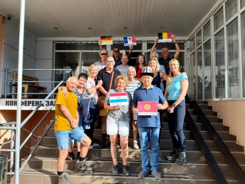 a group of people standing on stairs holding up certificates at Tagaytay Karakol Hotel in Karakol