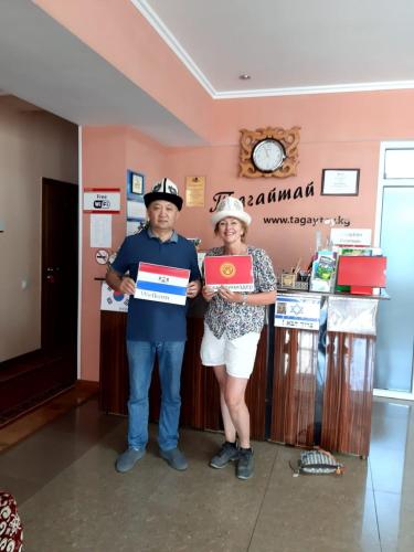 a man and a woman holding up a box at Tagaytay Karakol Hotel in Karakol