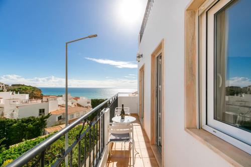a balcony with a view of the ocean at Bela Vista Burgau in Burgau