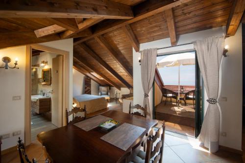 a dining room with a table and a view of the ocean at Solaria in Amalfi